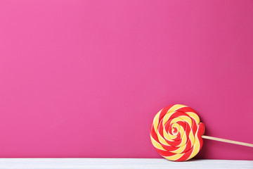 Sweet lollipop on a pink background