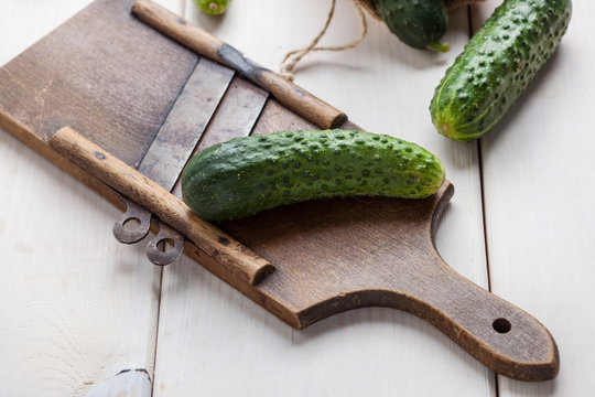 Raw cucumbers on cutting board.
