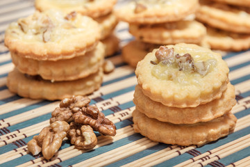 spicy cookies and walnuts on the bamboo napkin - 126028224