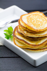 Bunch of pancakes on the wooden table