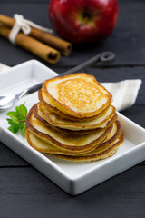 Cinnamon pancakes with apple. Rustic style. 