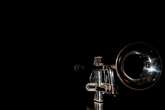trumpet, wind instrument / lonely musical instrument which is a trumpet on a black background
