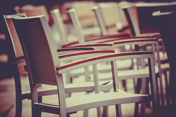 Empty chairs outside cafe