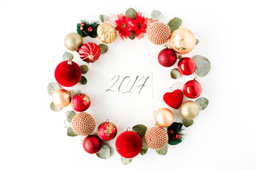christmas wreath frame made of colored bright christmas balls and calligraphy year 2017 on white...