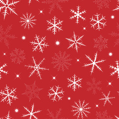 Seamless pattern from snowflakes and stars on red background.