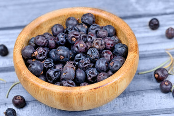 Juniper in a bowl on wooden table