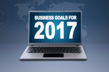 Laptop with world map background