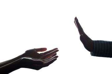 Women hand stretched with alms across from the refusal - silhoue