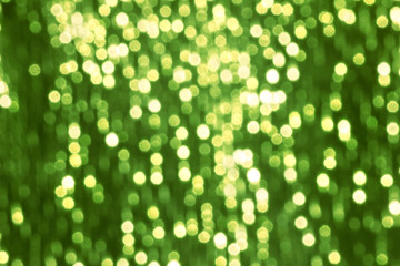 Glitter sparkling abstract green bokeh defocused background