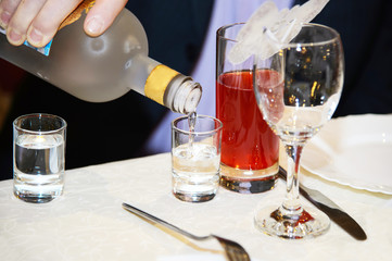 Alcoholic drink poured into a glass. Vodka and tequila - strong degree of alcohol. Drinks for...