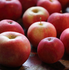 Group of red tasty apples on a plate
