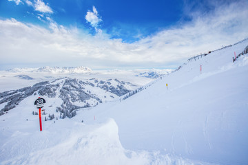 Fototapeta na wymiar Tyrolian alps and ski slopes in Austria in famous Kitzbühel ski resort.