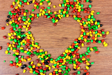 Colored candy lined heart. Declaration of love on the day of St. valetina.
