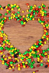 Colored candy lined heart. Declaration of love on the day of St. valetina.