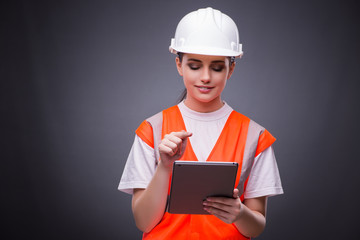 Young construction worker with tablet computer