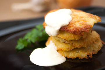 Potato pancakes with sour cream