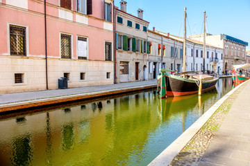 Fototapeta na wymiar boat canal colorful italian village Comacchio Italy