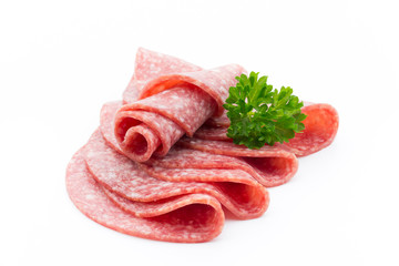 Salami smoked sausages slices isolated on white background.