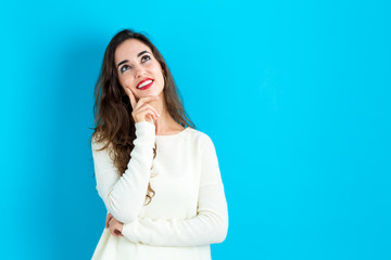 Young woman in a thoughtful pose