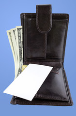 open wallet with dollars, clean business card. place for your te