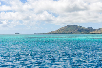 Fototapeta premium Colorful water near Nacula Island in Fiji