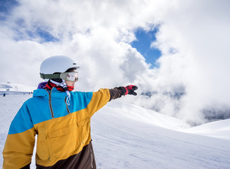 Fototapeta na wymiar Snowboarder woman in mountains