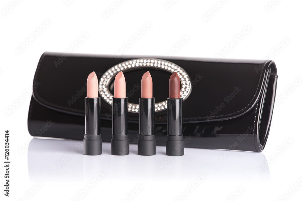 Wall mural set of four trendy lipsticks and black handbag clutch