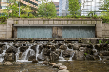 Artificial waterfall along the Cheonggyecheon Stream in Seoul, South Korea, viewed from the front.