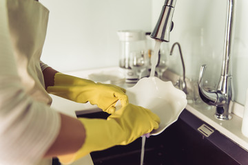 Woman cleaning her kitchen