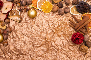 Obraz na płótnie Canvas Christmas background with decorations on crumpled copper paper