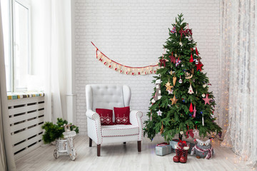 Merry christmas and new year background. Classic green tree decorated in christmas toys.