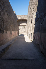 Fototapeta na wymiar Narrow street in the ancient city of Pompeii, Italy