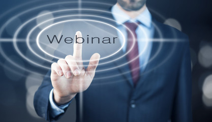 Businessman pressing a webinar