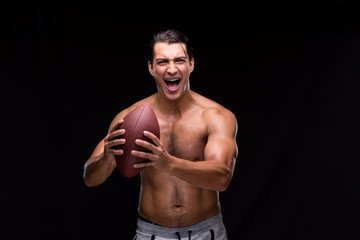 Ripped muscular man with american football