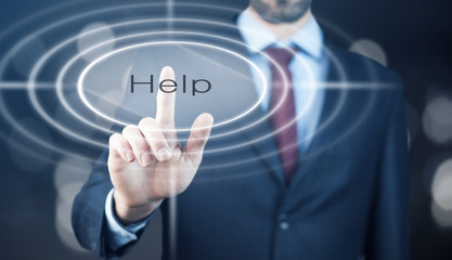 Businessman pressing a Help