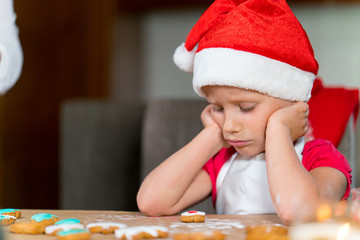 Mother and daughter are preparing gingerbread for Christmas
