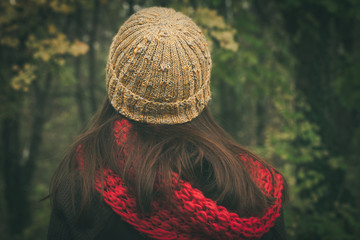back view of woman with wool cap and scarf