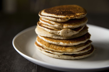 Stack of Golden Brown Pancakes on a White Plate for Morning Breakfast or Brunch