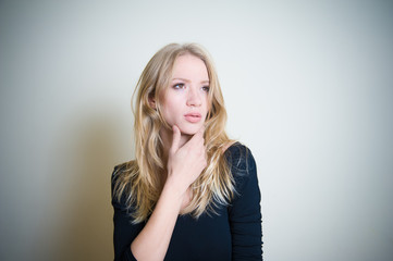 Fototapeta premium Thoughtful young blonde woman portrait