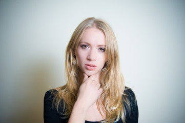Naklejka premium Thoughtful young blonde woman portrait