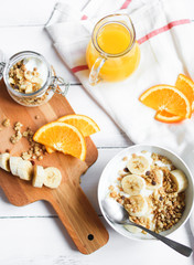breakfast on wooden table with granola top view