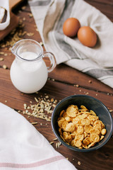 flakes for breakfast and jug of milk top view