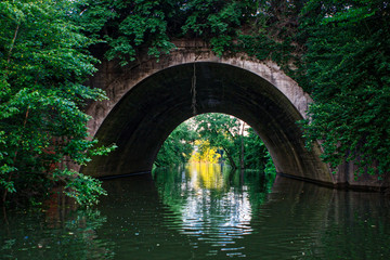 Arched stone tunnel over water