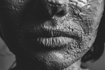 Woman face with cracked skin