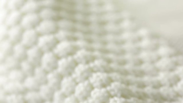 white knitted wool texture. use as background. close-up