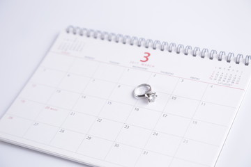 wedding ring and calendar