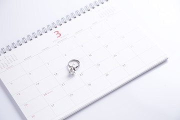 wedding ring and calendar