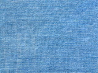 Light blue natural denim texture or blue jeans background