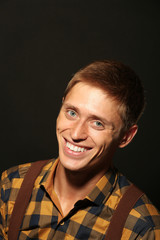 Portrait of stylish man on dark background