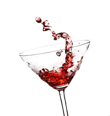 Red cocktail with splash on white background